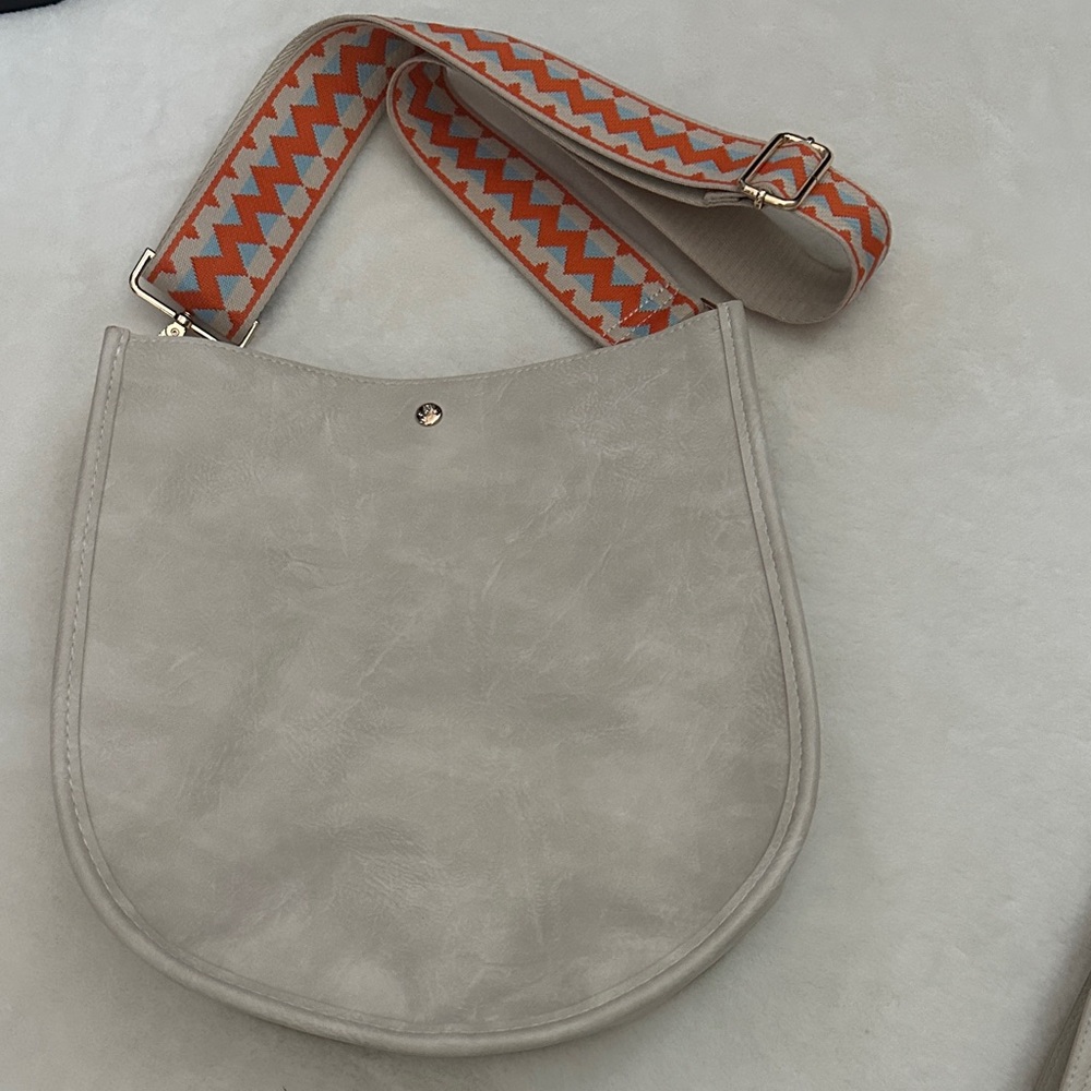 Elegant Cream Shoulder Bag with Orange Patterned Strap
